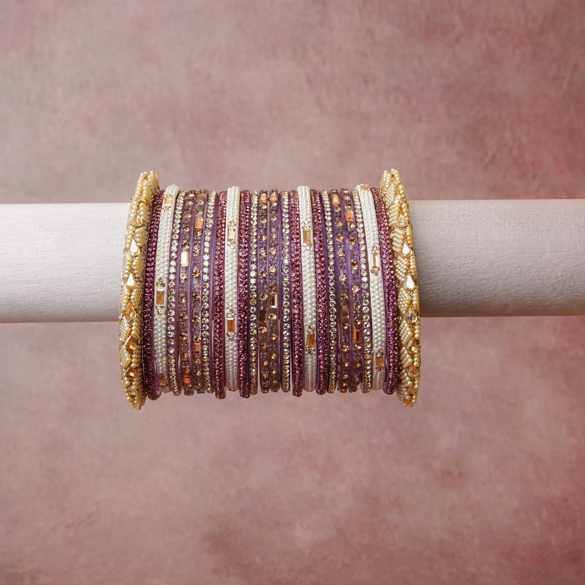 A grounding Lilac forms the heart of the set, while touches of Fuchsia Pink, Rose Gold, Clear Crystal, Pearl White add charm.

A thoughtful composition of Acrylic, Gold-toned Metal, Rhinestones, Faux Pearls, designed to feel complete without being heavy.
Each element layers seamlessly, creating a look that is refined, wearable and quietly striking.